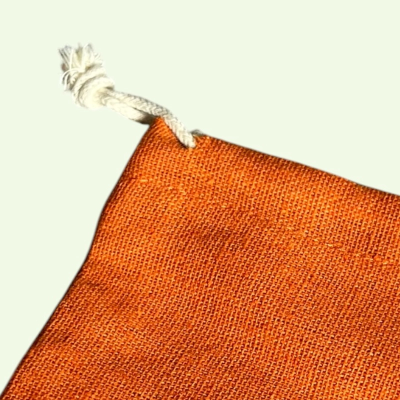 MEDIUM POLYCOTTON DRAWSTRING BAG IN BURNT ORANGE