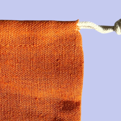 MEDIUM POLYCOTTON DRAWSTRING BAG IN BURNT ORANGE